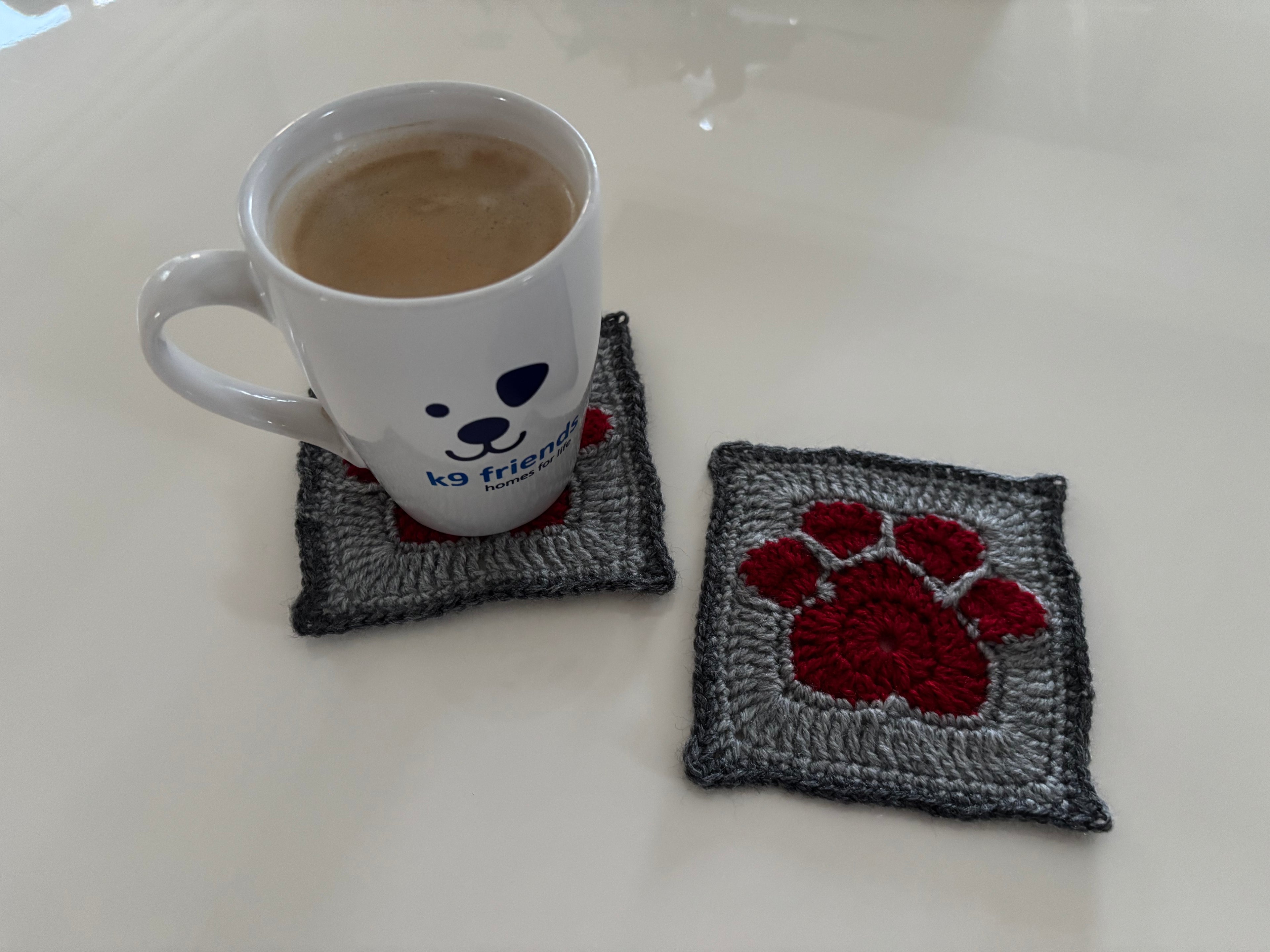 Set of 2 coasters in assorted colors hand made by the volunteers at K9 friends